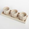 Betonowe świeczniki na tealight z podstawką: odcienie beżowego